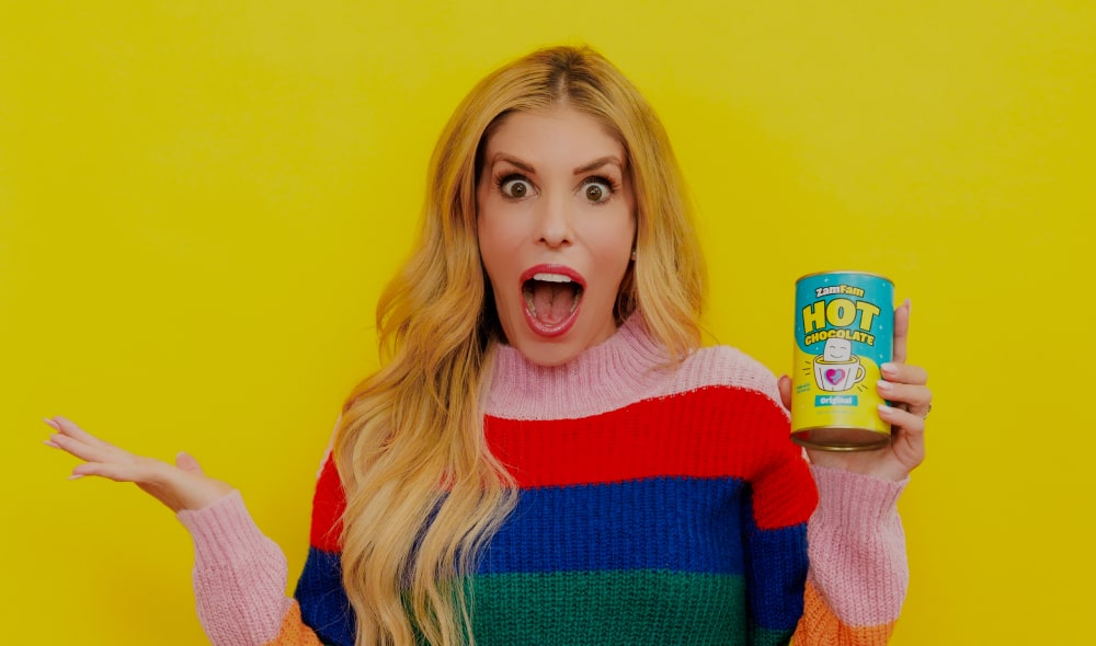 Rebecca Zamolo holding Zamfam hot chocolate.