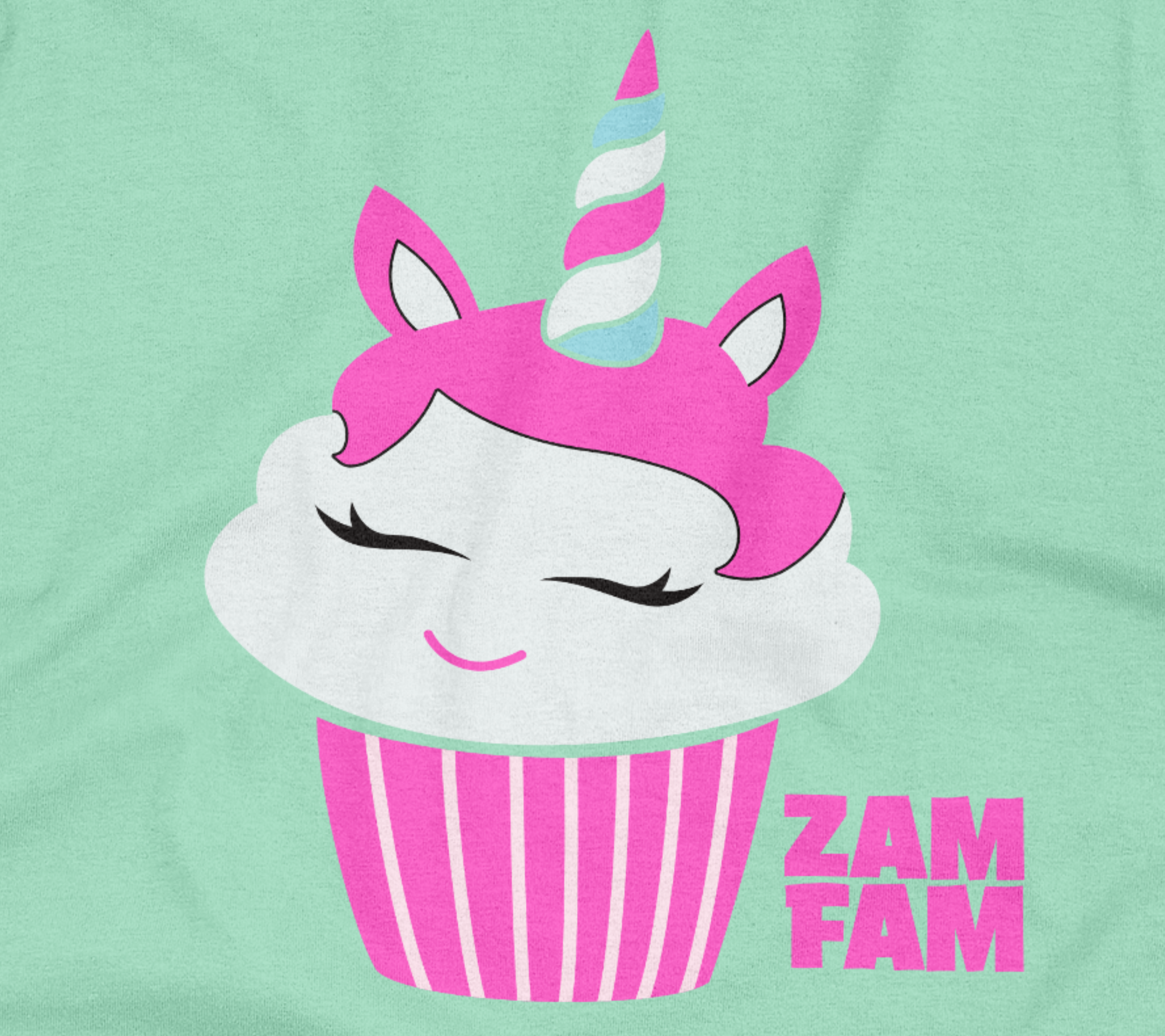 Close up of the teal tee featuring a cupcake unicorn design.