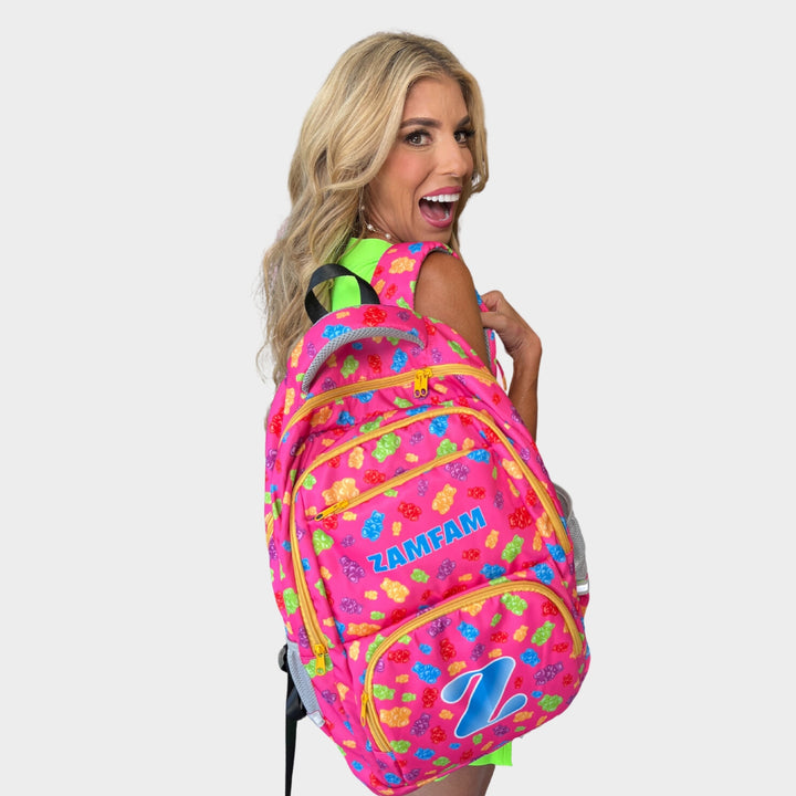 Rebecca Zamolo wearing her pink Zamfam backpack with gummy bear print