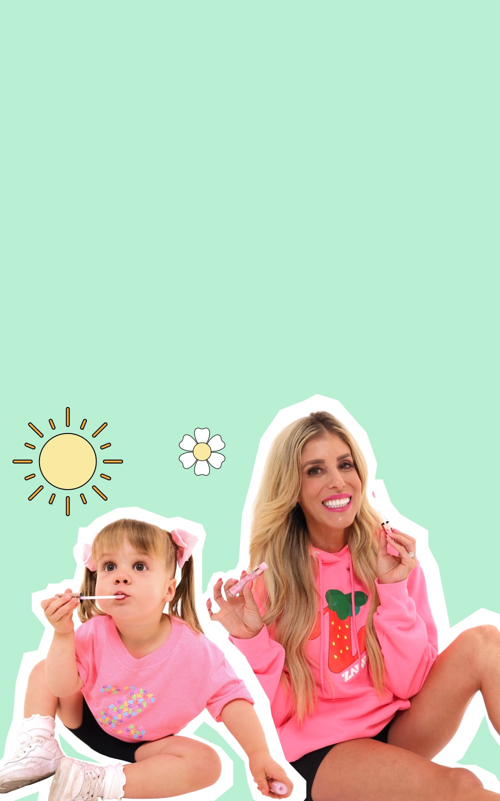 Rebecca Zamolo and her daughter wearing Zamfam merch.