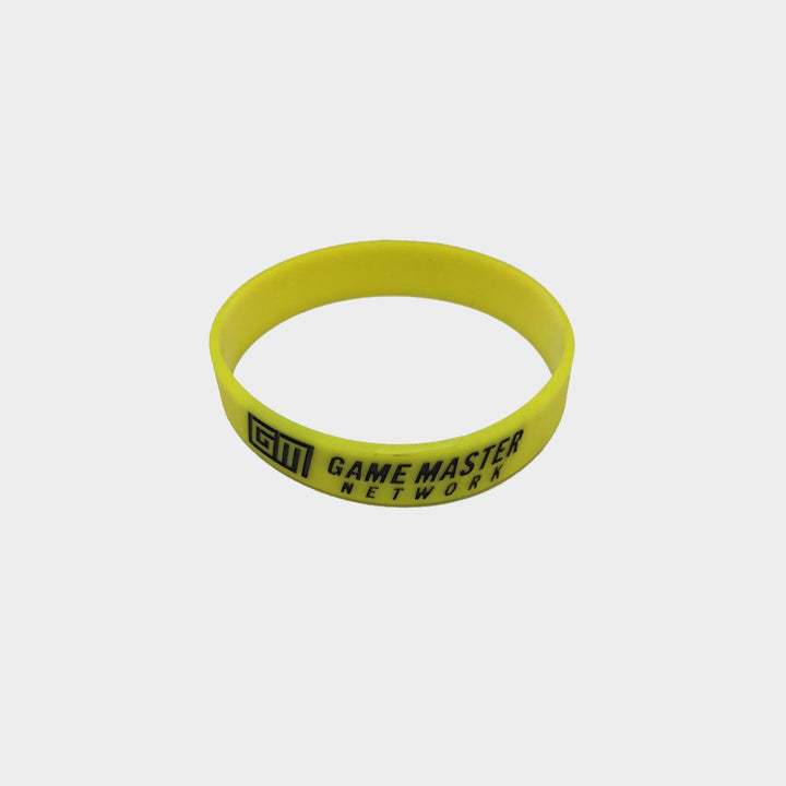 Yellow Silicone bracelet featuring a Game Master Network Print