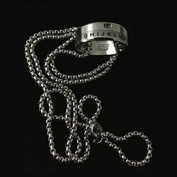 Game Master Decoder Ring with a chain necklace