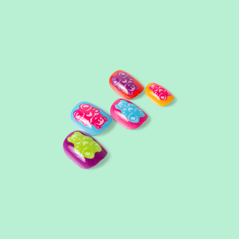 Five Zamfam press on nails featuring gummy bear designs.