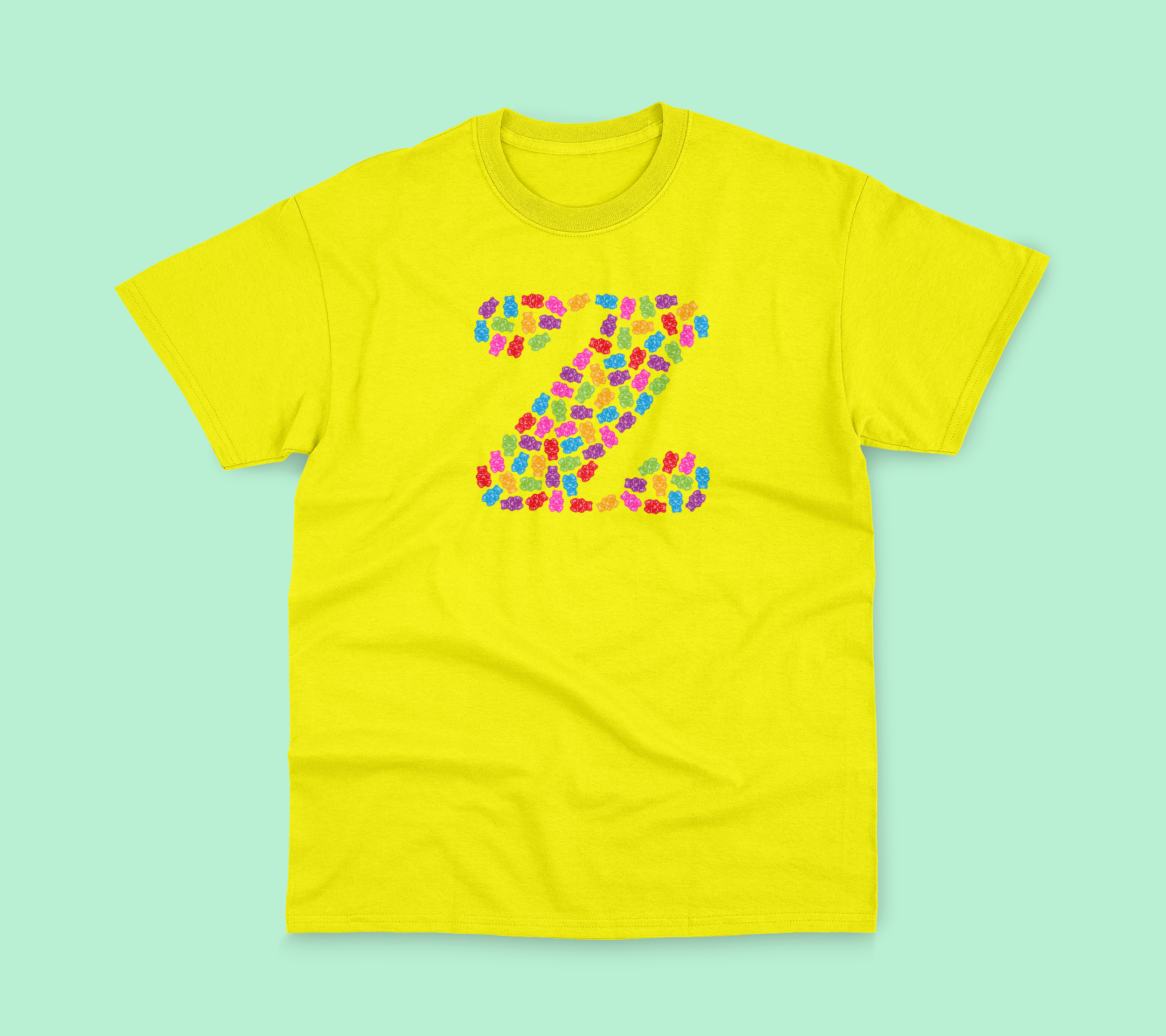 Yellow tee with gummy bear designs.