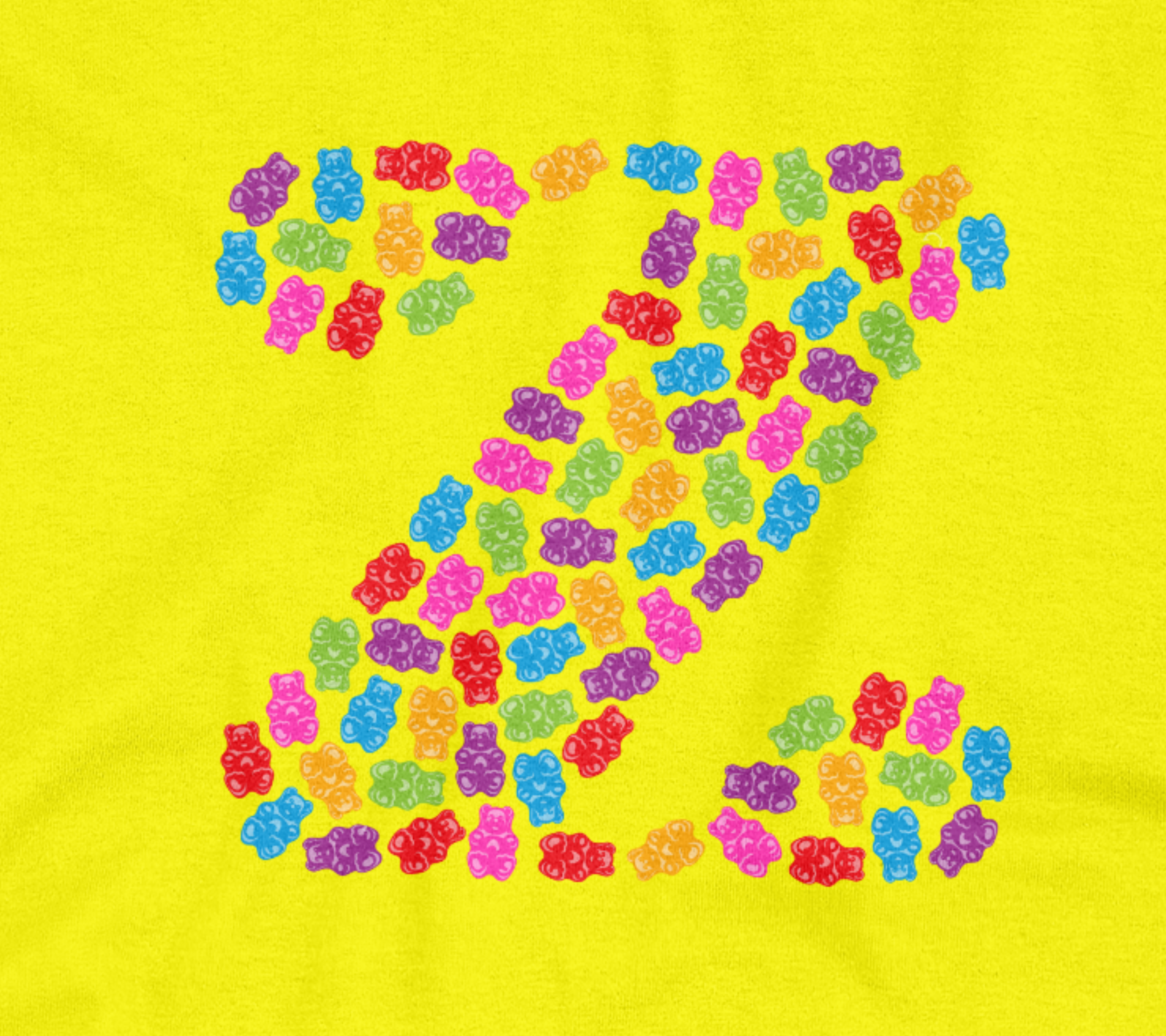 Close up of the yellow tee with gummy bear designs.