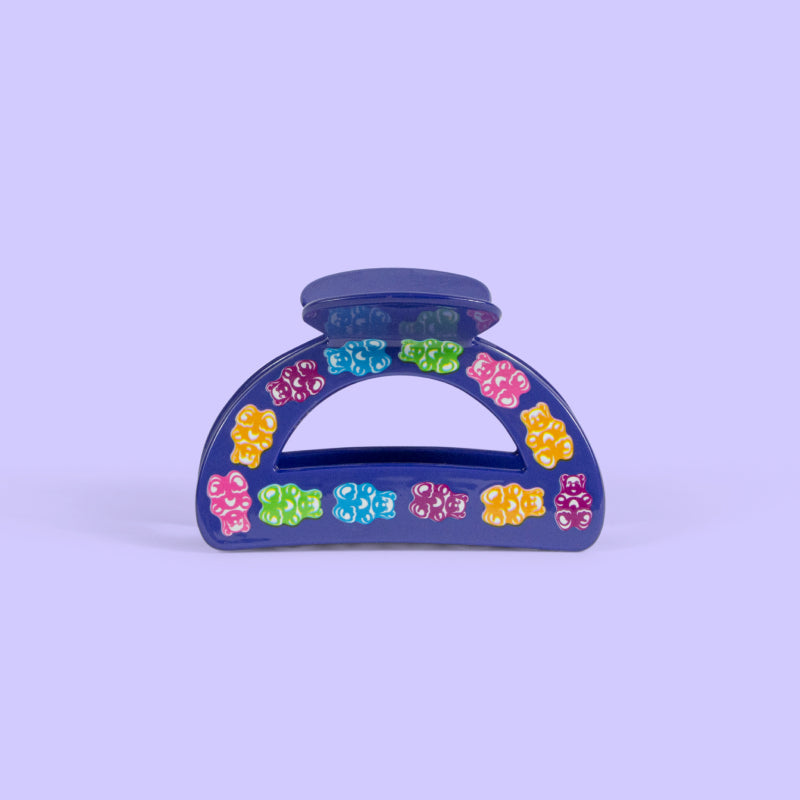 Purple hair clip with gummy bear designs.