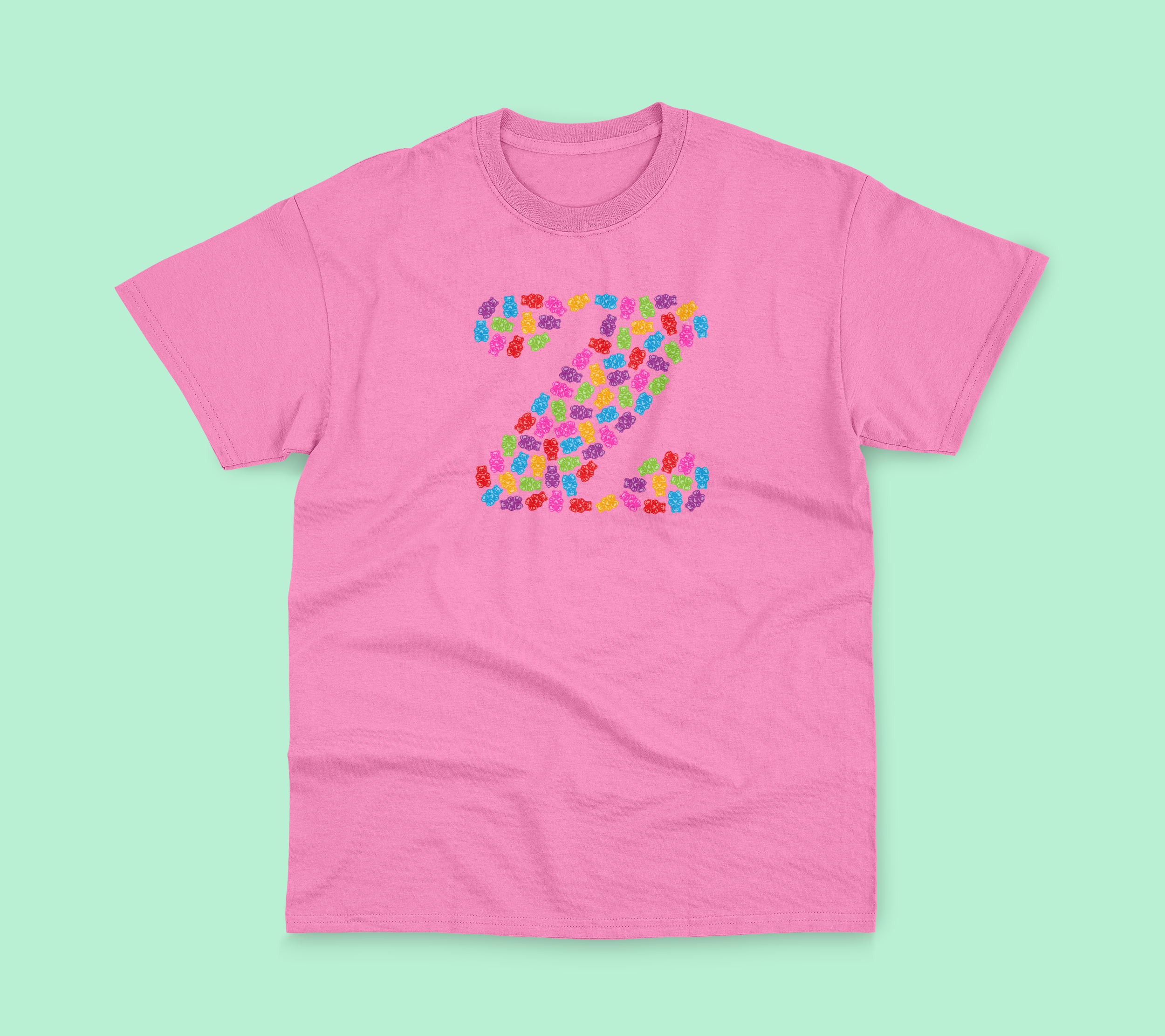 Pink tee with gummy bear designs.