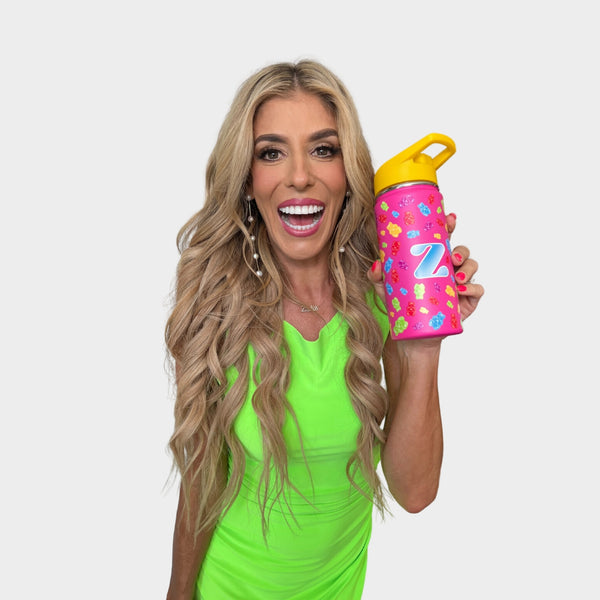 Rebecca Zamolo holding her Zamfam Water bottle with a gummy bear print